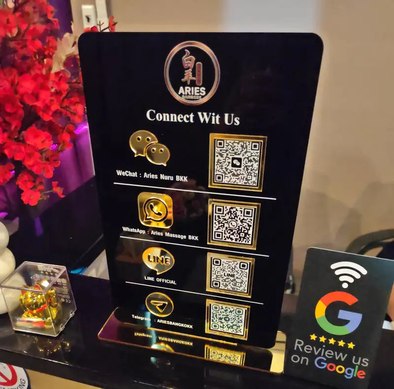 Black and gold Aries contact stand with QR codes for LINE, WeChat, WhatsApp and Telegram